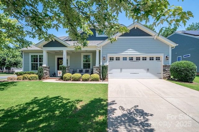 658 Gardenbrook Trl, Belmont, NC 28012 - craftsman-style home featuring an attached garage, a porch, a front yard, concrete driveway, and stone siding