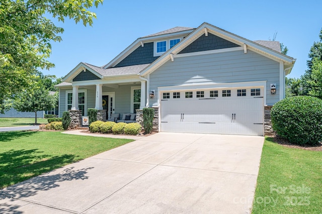 658 Gardenbrook Trl, Belmont, NC 28012 - craftsman inspired home with covered porch, a front yard, an attached garage, concrete driveway, and stone siding