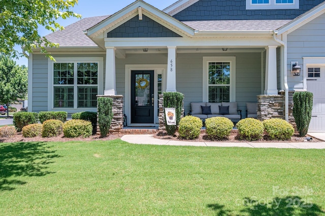 658 Gardenbrook Trl, Belmont, NC 28012 - view of front facade with a shingled roof, a front yard, a porch, and stone siding