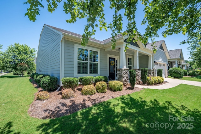 658 Gardenbrook Trl, Belmont, NC 28012 - view of front of home featuring a front lawn, a garage, driveway, and a porch