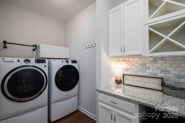 658 Gardenbrook Trl, Belmont, NC 28012 - washroom with washing machine and clothes dryer, cabinet space, and dark wood-type flooring