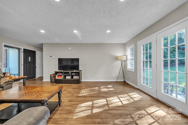 5476 Twelve Oak Ln, Conover, NC 28613 - living area featuring a textured ceiling, recessed lighting, and wood finished floors