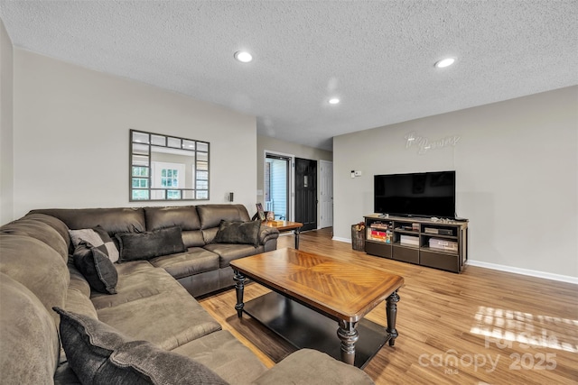 5476 Twelve Oak Ln, Conover, NC 28613 - living room with a textured ceiling, wood finished floors, and recessed lighting