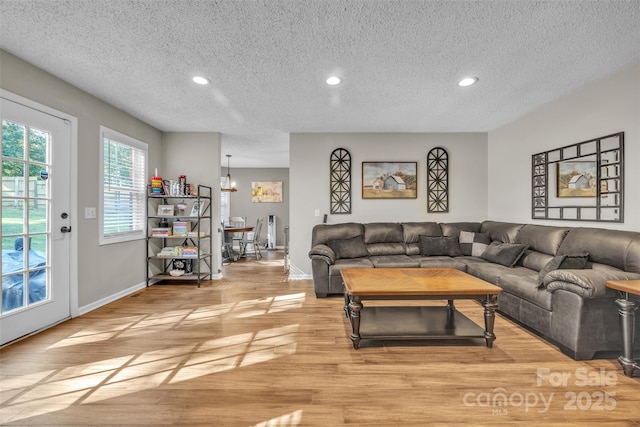 5476 Twelve Oak Ln, Conover, NC 28613 - living area with a textured ceiling, light wood-style flooring, and recessed lighting