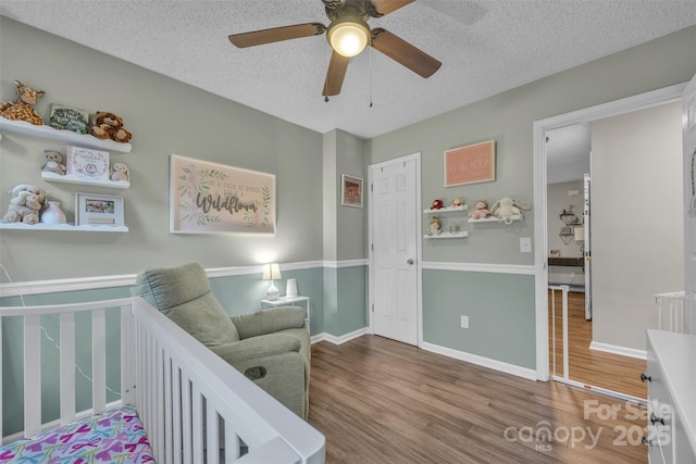 5476 Twelve Oak Ln, Conover, NC 28613 - bedroom with wood finished floors, a textured ceiling, and ceiling fan