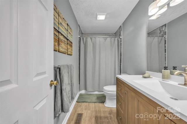 5476 Twelve Oak Ln, Conover, NC 28613 - bathroom with a textured ceiling, wood finished floors, vanity, and a shower with curtain