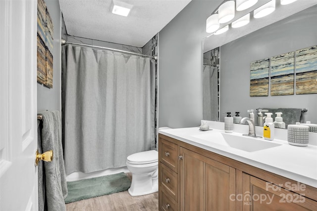 5476 Twelve Oak Ln, Conover, NC 28613 - full bath featuring vanity, wood finished floors, a textured ceiling, and shower / tub combo