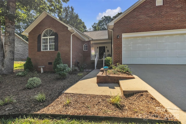 5476 Twelve Oak Ln, Conover, NC 28613 - view of front of home with brick siding, an attached garage, driveway, and crawl space