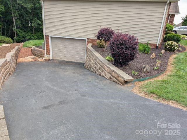 1764 Pipers Ridge Cir NW, Conover, NC 28613 - garage with asphalt driveway