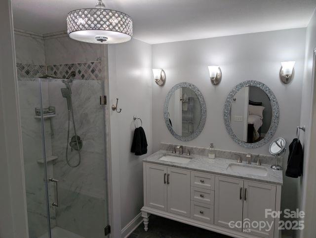 1764 Pipers Ridge Cir NW, Conover, NC 28613 - full bathroom with double vanity and a stall shower