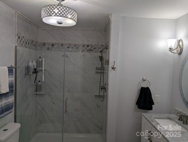 1764 Pipers Ridge Cir NW, Conover, NC 28613 - full bathroom featuring a marble finish shower and vanity