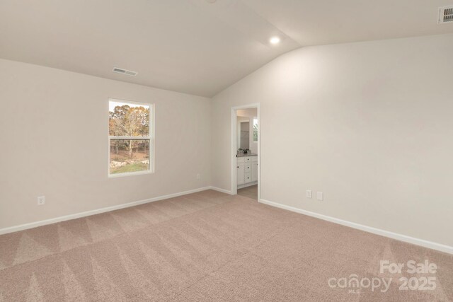 1041 Russell Dr, Winston Salem, NC 27127 - unfurnished room with light carpet and vaulted ceiling