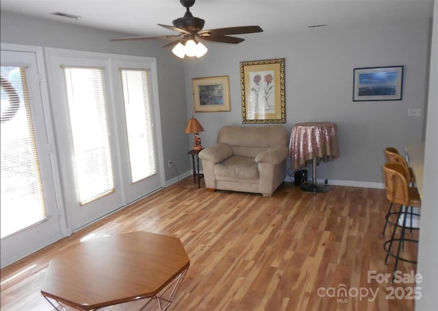 6148 Meadow Rose Ln, Charlotte, NC 28215 - living area featuring ceiling fan and light wood-type flooring