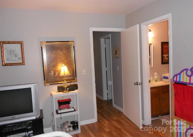 6148 Meadow Rose Ln, Charlotte, NC 28215 - bedroom with wood finished floors and baseboards