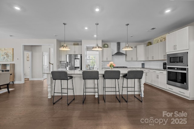 241 Boxelder Rd, Clover, SC 29710 - kitchen featuring appliances with stainless steel finishes, wall chimney range hood, tasteful backsplash, white cabinets, and recessed lighting