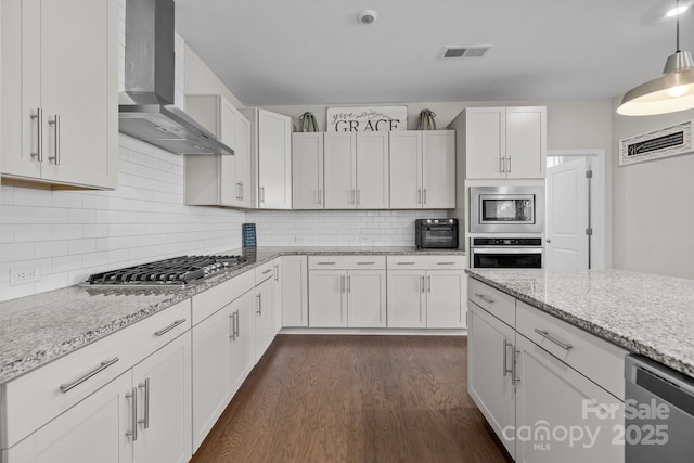 241 Boxelder Rd, Clover, SC 29710 - kitchen with wall chimney exhaust hood, appliances with stainless steel finishes, dark wood-style floors, tasteful backsplash, and white cabinets