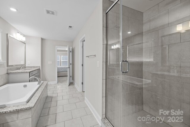241 Boxelder Rd, Clover, SC 29710 - ensuite bathroom featuring a shower stall, vanity, tile patterned flooring, and a garden tub