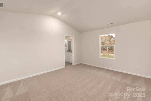 1048 Russell Dr, Winston Salem, NC 27127 - empty room featuring lofted ceiling and light colored carpet