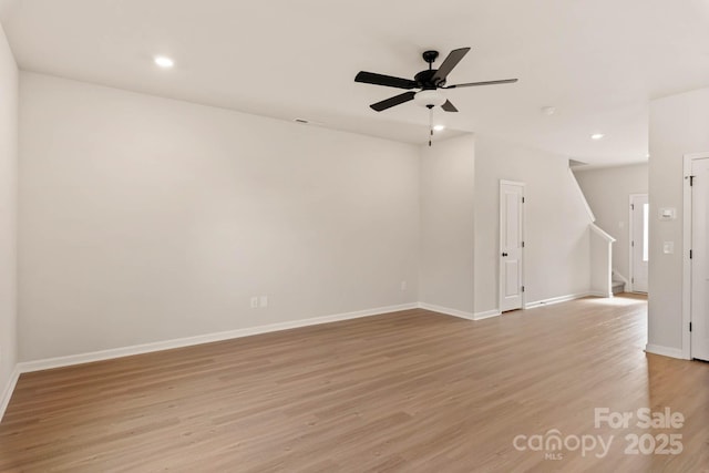 1048 Russell Dr, Winston Salem, NC 27127 - empty room with light wood-style floors, stairway, a ceiling fan, and recessed lighting