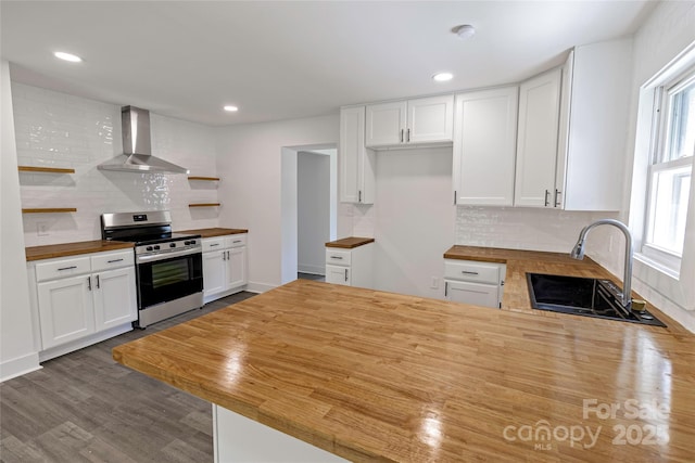 132 Kennedy Ave, Kannapolis, NC 28083 - kitchen with wood counters, stainless steel electric range oven, wall chimney exhaust hood, open shelves, and a peninsula