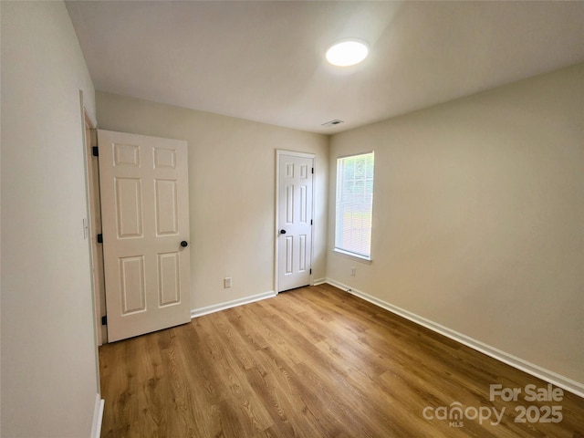 3106 Faircroft Way, Monroe, NC 28110 - unfurnished bedroom featuring baseboards and wood finished floors
