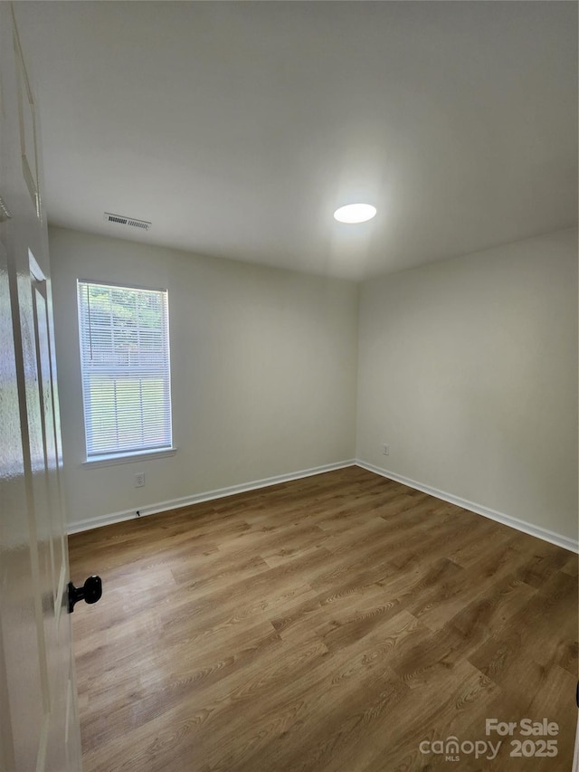 3106 Faircroft Way, Monroe, NC 28110 - spare room with wood finished floors and baseboards