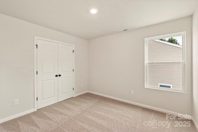 1072 Russell Dr, Winston Salem, NC 27127 - unfurnished bedroom with carpet flooring and a closet