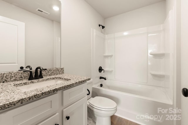1072 Russell Dr, Winston Salem, NC 27127 - bathroom with vanity, shower / bath combination, and wood finished floors