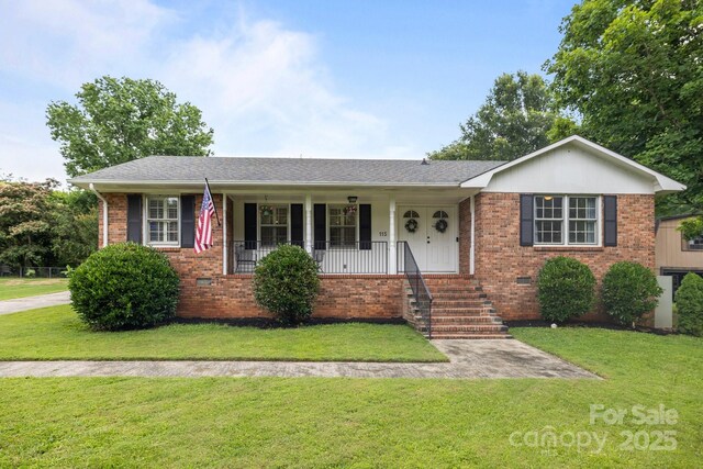 115 Fox Run Dr, Fort Mill, SC 29715 - ranch-style house with brick siding, a front lawn, and covered porch