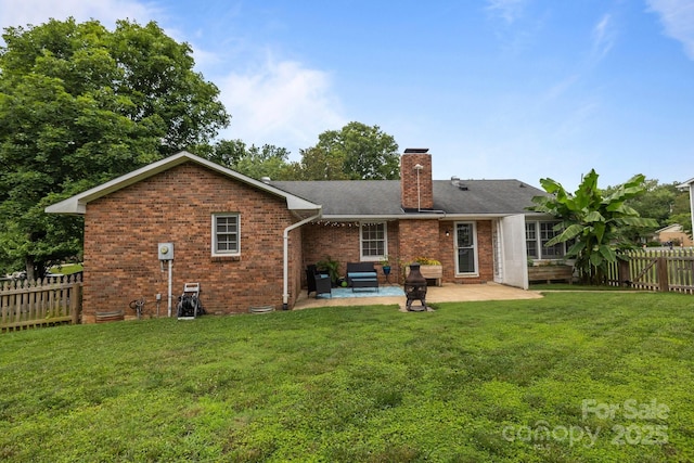 115 Fox Run Dr, Fort Mill, SC 29715 - rear view of house with a patio area, a chimney, a fenced backyard, brick siding, and roof with shingles