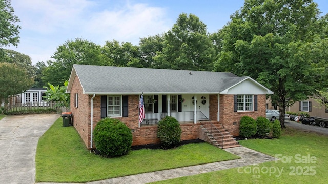 115 Fox Run Dr, Fort Mill, SC 29715 - ranch-style home featuring a porch, brick siding, a front lawn, roof with shingles, and driveway
