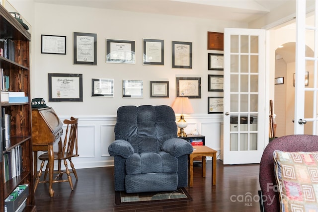 1156 Mckee Farm Ln, Belmont, NC 28012 - sitting room with arched walkways, a decorative wall, wood finished floors, french doors, and wainscoting