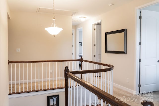 1156 Mckee Farm Ln, Belmont, NC 28012 - hallway featuring attic access, an upstairs landing, and carpet flooring