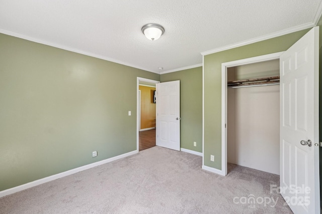 1069 Heather Glen Dr, Catawba, NC 28609 - unfurnished bedroom with ornamental molding, carpet, a closet, and a textured ceiling
