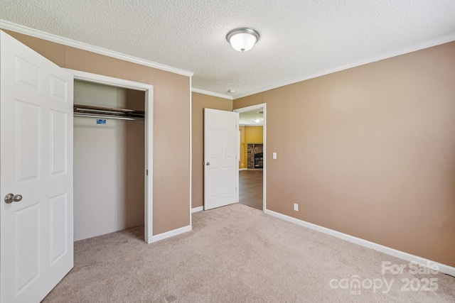 1069 Heather Glen Dr, Catawba, NC 28609 - unfurnished bedroom featuring carpet floors, crown molding, a textured ceiling, and a closet
