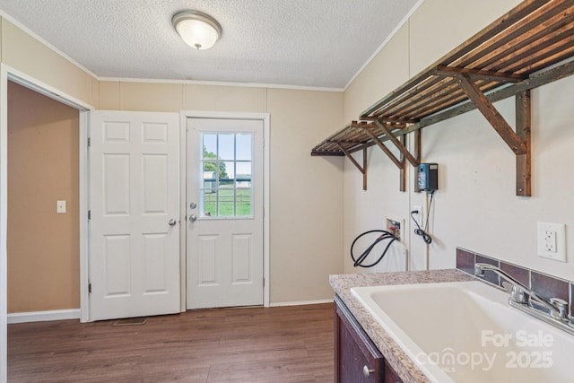 1069 Heather Glen Dr, Catawba, NC 28609 - washroom with washer hookup, ornamental molding, a textured ceiling, and wood finished floors