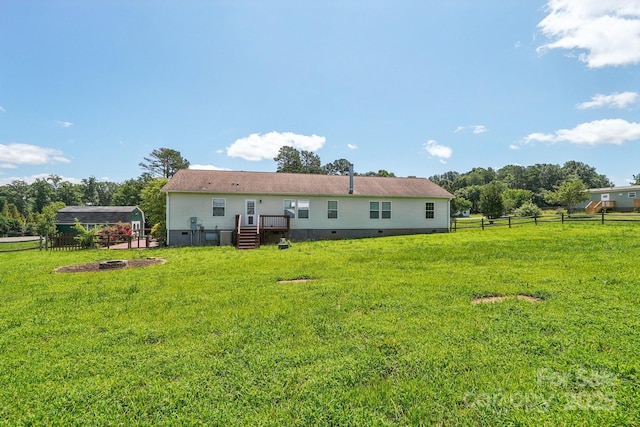 1069 Heather Glen Dr, Catawba, NC 28609 - back of house featuring crawl space and a fire pit