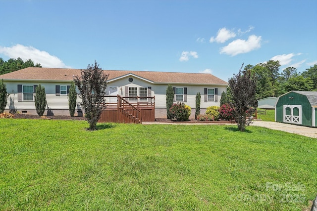 1069 Heather Glen Dr, Catawba, NC 28609 - view of front of house with a storage unit and a front yard