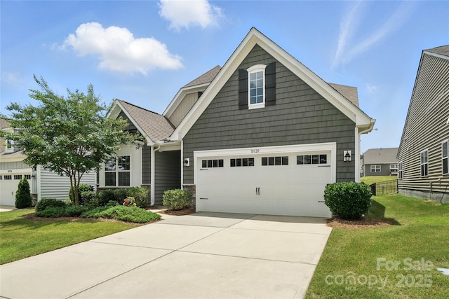 10120 Berkeley Castle Dr, Charlotte, NC 28273 - craftsman inspired home featuring a front yard, concrete driveway, and a shingled roof