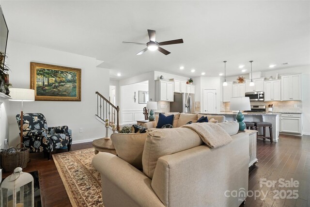 10120 Berkeley Castle Dr, Charlotte, NC 28273 - living area featuring a ceiling fan, recessed lighting, dark wood-type flooring, and stairway