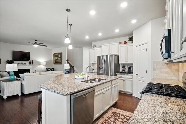 10120 Berkeley Castle Dr, Charlotte, NC 28273 - kitchen featuring stainless steel appliances, a ceiling fan, white cabinets, dark wood-style flooring, and recessed lighting