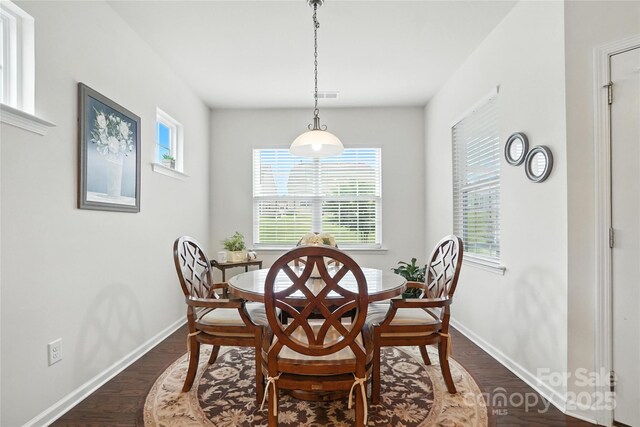 10120 Berkeley Castle Dr, Charlotte, NC 28273 - dining area featuring dark wood-type flooring and baseboards