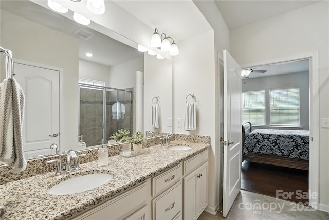 10120 Berkeley Castle Dr, Charlotte, NC 28273 - full bathroom featuring healthy amount of natural light, double vanity, a shower stall, and tile patterned flooring