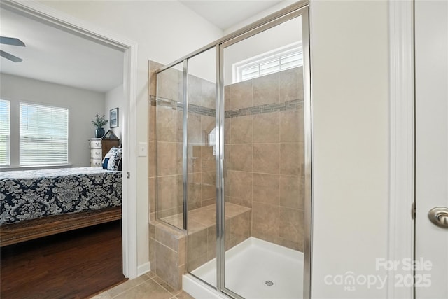 10120 Berkeley Castle Dr, Charlotte, NC 28273 - ensuite bathroom with a stall shower, tile patterned flooring, and a ceiling fan