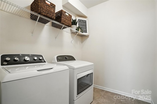 10120 Berkeley Castle Dr, Charlotte, NC 28273 - laundry room with washer and clothes dryer and light tile patterned flooring