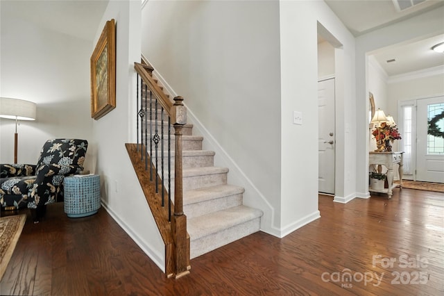 10120 Berkeley Castle Dr, Charlotte, NC 28273 - foyer featuring wood finished floors, stairs, and ornamental molding