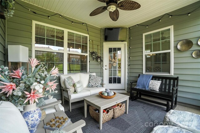 10120 Berkeley Castle Dr, Charlotte, NC 28273 - porch featuring ceiling fan and outdoor lounge area