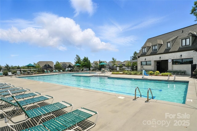 10120 Berkeley Castle Dr, Charlotte, NC 28273 - community pool featuring a patio area and a residential view