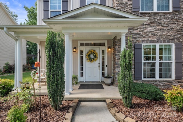 137 Branchview Dr, Mooresville, NC 28115 - doorway to property featuring stone siding and a porch