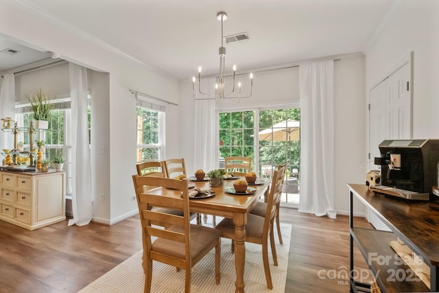 137 Branchview Dr, Mooresville, NC 28115 - dining room featuring a chandelier, light wood-style floors, and ornamental molding